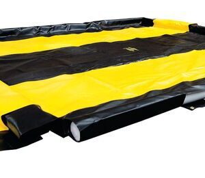 The Justrite Berm in black and yellow features alternating sections with raised edges for spill control. Its spacious 10X11X4 design ensures efficient liquid containment.