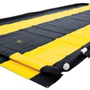 A Washdown 12X26X4 Justrite Berm in black and yellow lies flat on the ground, featuring strong side walls for leak or spill containment. The contrasting colors boost visibility and safety.