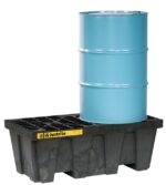 A blue metal barrel sits on a Justrite Pallet, 2 Drum, Ecopoly Blk spill containment pallet with a grid top. The durable pallet includes a yellow label with black text and symbols for storage safety and compliance.