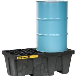 A blue metal barrel sits on a Justrite Pallet, 2 Drum, Ecopoly Blk spill containment pallet with a grid top. The durable pallet includes a yellow label with black text and symbols for storage safety and compliance.