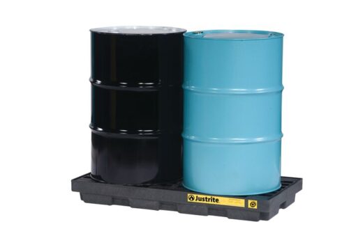 Two industrial drums, one black and one blue, are securely placed on a Justrite Accum Ctr, 2 Drum, Ecopoly Blk spill containment pallet.