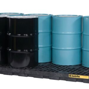 Six industrial barrels, three black and three blue, are neatly arranged in two rows on a black Justrite Accum Ctr, 8 Drum Ecopoly Blk spill containment pallet featuring a yellow label on the front.