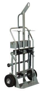 The Justrite Gcyl Ht Fpt10, a gray hand truck with a sturdy metal frame, excels at heavy lifting with two large black wheels and a small front platform. Its tall, reinforced handle ensures easy maneuverability, making it essential for heavy-duty tasks.