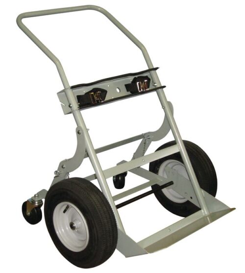 The Justrite Gcyl Ht,2Cyl,4W,Fpt,16 hand truck features a sturdy metal frame, large rubber wheels, and a flat base for carrying items. It includes handles for easy maneuvering and small pivoting wheels at the back for added support and stability.