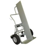 The Justrite Gcyl Ht,2Cyl,Fw,4W,Fpt,16 is a gray hand truck ideal for moving heavy objects. It features sturdy handles with chains for securing and rests on a flat metal base with two large rubber wheels and a tall vertical back for easy loading.