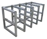 The Justrite Gcyl Barricade Rack,4X2,Ss features four metal square frames connected by chains. Its minimalist design uses 4X2 horizontal and vertical bars, and the chains provide an industrial touch.