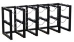 The Justrite Gcyl Barricade Rack, 5X2, is a black metal bike rack with four zigzag-patterned sections and chains for securing bicycles, providing ample space to park and lock multiple bikes securely.