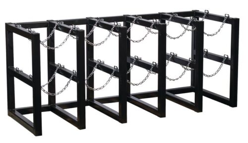 The Justrite Gcyl Barricade Rack, 5X2, is a black metal bike rack with four zigzag-patterned sections and chains for securing bicycles, providing ample space to park and lock multiple bikes securely.