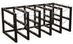 The Justrite Gcyl Barricade Rack, 5X3, is a black metal storage unit with five sections and safety chains, designed to securely hold and organize multiple gas cylinders.