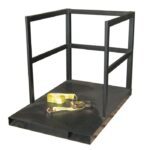 A black metal Justrite Gcyl Fklft Pllt,14Cyl,Endld platform features railings on three sides, resembling a small cage. A yellow strap with a metal buckle sits on the platforms floor.