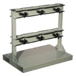 The Justrite Gcyl Fklft Pllt,6Cyl,B2B is a robust two-tier storage rack designed for kayaks in B2B settings. It features padded horizontal supports and adjustable straps for securing kayaks, while a wide base ensures stability.