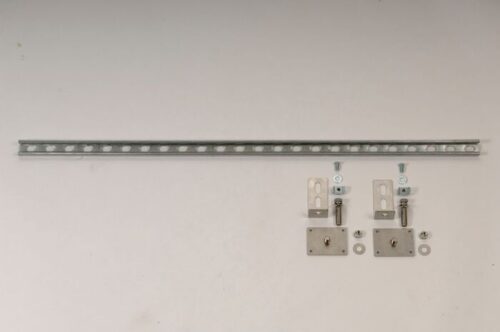 The Justrite Seismic Brkt F/Cabnet, Flr/Wal hardware set, shown on a white background, features a long perforated metal strip with neatly arranged brackets, bolts, nuts, and screws. Ideal for floor and wall applications to ensure stability.