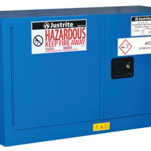 The Justrite Cabinet in blue, designed for acid and Haz Mat Pigybk 17G Sc storage, features labels HAZARDOUS KEEP FIRE AWAY and ACID STORAGE CABINET, along with a black handle and warning symbols to ensure safe storage.