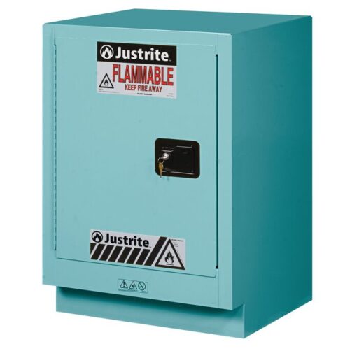A blue Justrite Cabinet Fmhd Chmc 15G Mn/L features a Flammable warning and Keep Fire Away text on its door, a lockable black handle, and the FMHD CHMC 15G MN/L logo at the top.