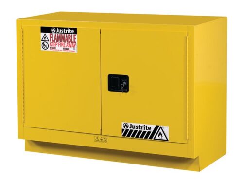 The Justrite Cabinet FMHD 31G/48 Man Yel is a yellow flammable storage cabinet with two doors, warning signs for flammable materials and to keep fire away, and a black handle on the front.
