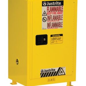The Justrite Cab Bshock Flam Cmp 12G Sc Yel is a yellow safety cabinet with Flammable Keep Fire Away in bold red, a sturdy black handle, and is designed for securely storing flammable liquids with clear warning symbols.
