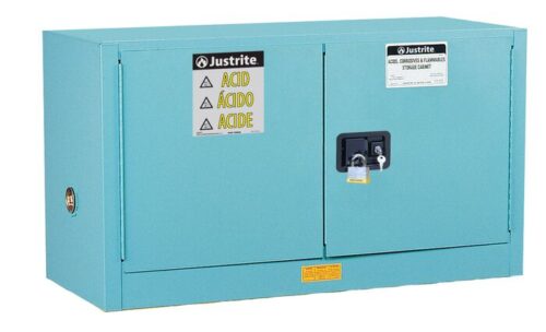 The Justrite Cabinet, Acid Pigy 17G, Mn Blu is a blue metal safety cabinet with dual doors labeled ACID in multiple languages. It features a secure lock and safety warnings with the Justrite brand prominently displayed on the top left.