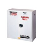 The white Justrite Cabinet, Flam Waste 30G Man Wh, prominently displays Flammable Waste, safety warnings, hazard symbols, and a Keep Fire Away message. It features two doors secured with a black lock for added safety.