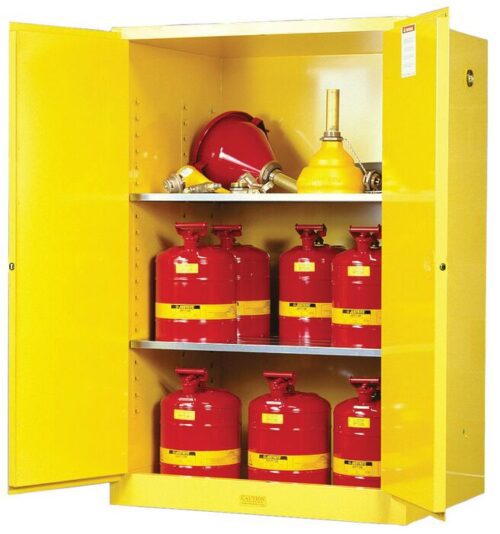 A Justrite Cabinet, model Flam Sfty 90G Man Yel, showcases open doors with red metal safety cans with yellow bands on the bottom and middle shelves and neatly arranged funnels on the top shelf, all engineered for safe flammable liquid storage.