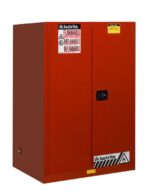 The Justrite Cabinet, Flam Sfty 90G Man Red, is a large red unit featuring safety stickers and a black handle, providing secure storage for flammable materials.