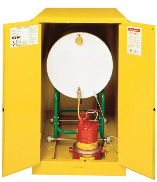 The open Justrite Cabinet Horzdrm (1)55G, Mn Yel reveals a large white drum on a green stand with a red pump below. Safety instructions and warning labels on the doors ensure safe handling and storage of hazardous materials.