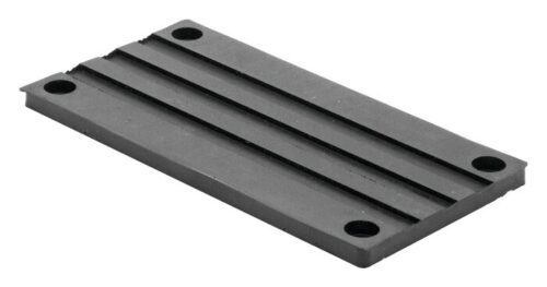 The Justrite Chock, model 3512, includes a rectangular metal base plate with four corner holes and two parallel grooves along its length.