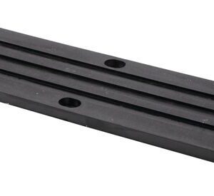 A Justrite Chock,Ac,Acc,3521,Rpad is shown as a black rectangular metal plate with grooves and six evenly spaced holes, featuring a smooth matte finish and resting at an angle on a white background.