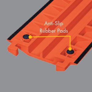 Close-up of an orange plastic object featuring anti-slip rubber pads for stability, similar to the Justrite Cp,Acc,Rpad Kit,.75,18Pk. It boasts grooves and a .75 precision design against a solid gray background.