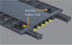 Close-up of Justrite Cp,Acc,Rpad Kit,1,8Pk gray modular panel features anti-slip rubber pads and yellow hollow compartments. Edges have serrated grips for safety.