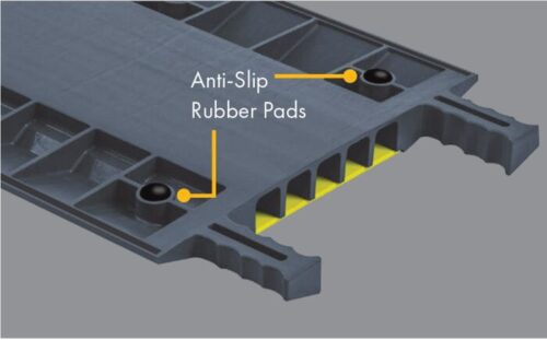 CPRPKIT1-8.jpg Close-up of Justrite Cp,Acc,Rpad Kit,1,8Pk gray modular panel features anti-slip rubber pads and yellow hollow compartments. Edges have serrated grips for safety.