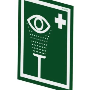 Green and white Justrite H, Ssaccy, Eyewash Sign displaying an eye above a vertical line with droplets, symbolizing an emergency eyewash station. Features a white cross in the top right corner.