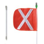 The Justrite Whip,Gp,10,Lit,F16,Of,Wx,Spqd features an orange safety flag with a reflective white X and a green-tipped pole. It is shown under streetlights twice: once attached to the pole and once detached and lying horizontally.