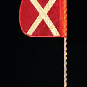 A Justrite Whip,Ap,Led,A,5,Of,Yx,A features a red flag with a yellow reflective X on a pole wrapped with spiral lights and topped with a bright bulb against black.