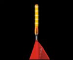 A luminous LED traffic wand light labeled Justrite Whip,Acc,Lgt,Led,Glo,1156,Hs,A is attached to a red safety cone against a black background. The wand is vertically positioned and brightly glowing orange.