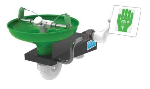 Image of a Justrite H safety eyewash station featuring dual spray nozzles mounted on a black base, with an emergency use sign showing an eye and hand pictogram.