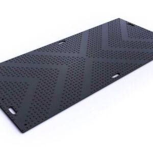The Justrite Mats Libmat 4X8 black mat features a textured chevron pattern with raised dots for grip and has rectangular edge cutouts for carrying or securing. Set against a plain white background, the design is noticeably sleek.