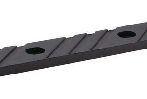 The Justrite Chock,Mc,Acc,3011,Rpad is a flat rectangular black metal strip with four evenly spaced holes and diagonal grooves.