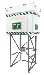 The Justrite H, Tnkshw, 520G, Ss, Qukshp, 110V emergency shower and eyewash station features a tall black metal frame with green and white safety markings. It includes a square tank on top and control valves below, with essential safety symbols prominently displayed.