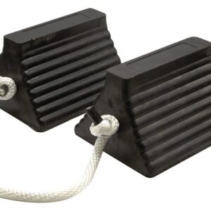 A pair of black, ribbed Justrite 10 pyramid chocks with a white rope handle prevents vehicles from moving.