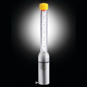 The Justrite Whip features a transparent cylindrical LED light in a clear tube with a yellow top, connected to a metallic base via a small screw. Its vivid glow contrasts sharply against the black backdrop.