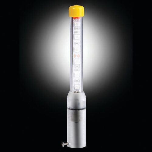 The Justrite Whip features a transparent cylindrical LED light in a clear tube with a yellow top, connected to a metallic base via a small screw. Its vivid glow contrasts sharply against the black backdrop.