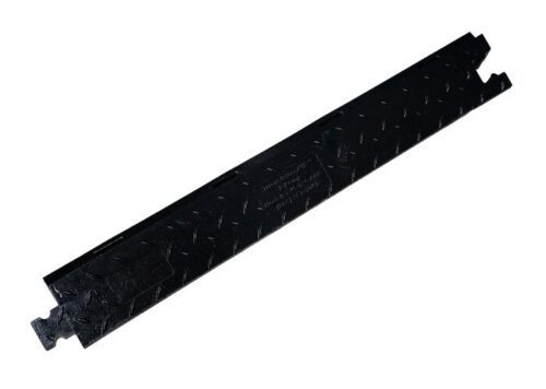 The Justrite Cp,Yj,5Ch,1.25,Ams,Rmp,F,B is a black metal trench cover with interlocking edges and a 1.25 textured surface, designed for utility protection at construction or industrial sites. Its elongated rectangular design meets Ams standards for safety and durability.