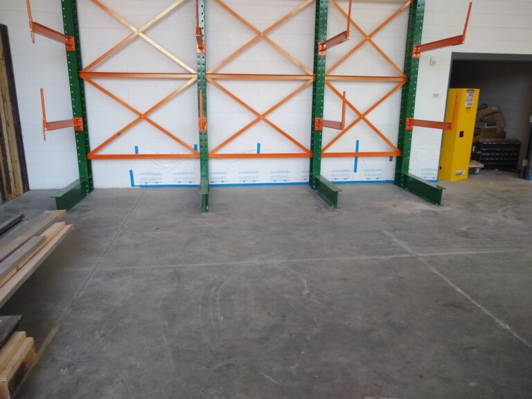 Green and orange cantilever rack installed in a Utah high school storage room