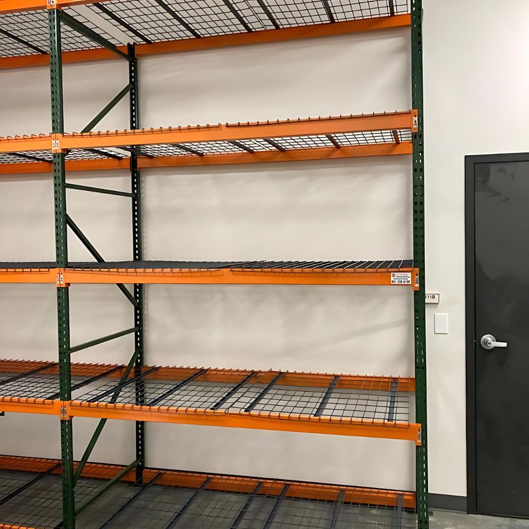 Green and orange pallet rack with wire decking in a college storeroom