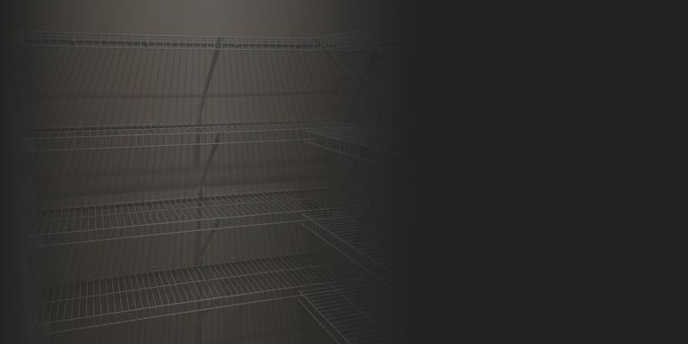 Industrial steel shelving units in a stock room with boxed inventory