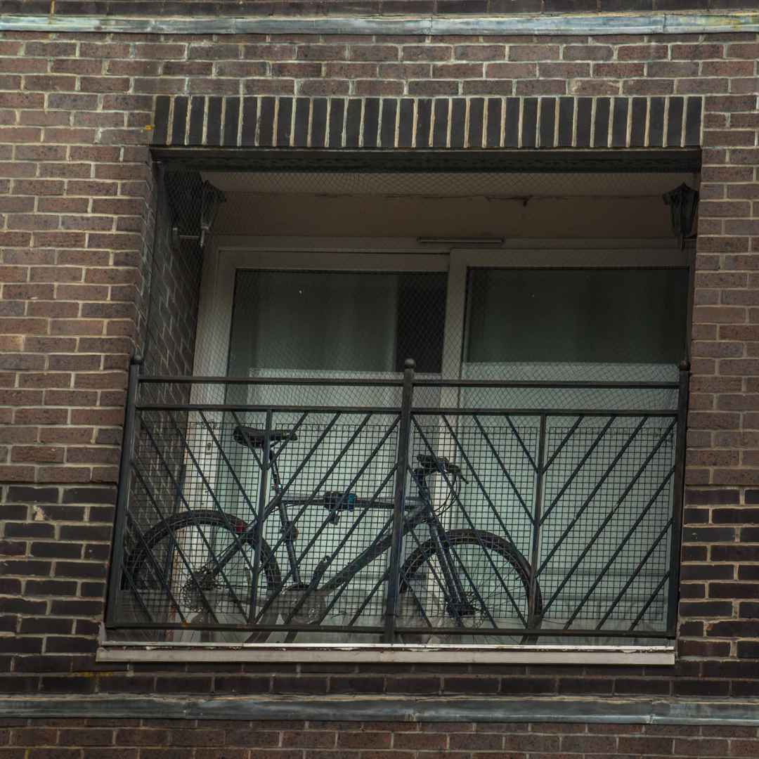 Bicycles stored on an apartment balcony