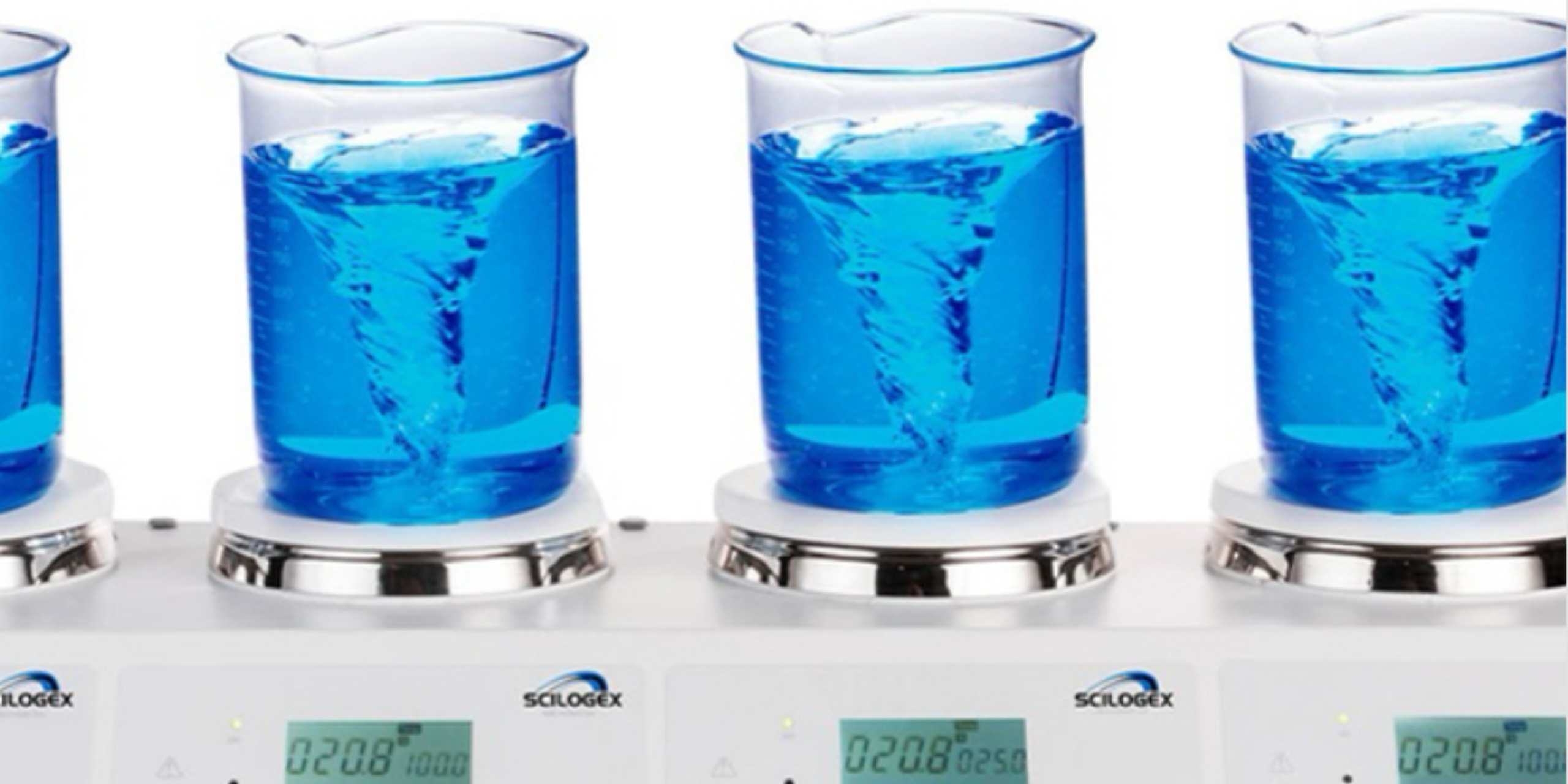Beakers of liquid on SciLogex digital hotplates in a laboratory