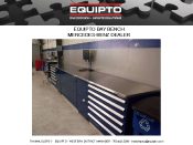 A long, blue workbench with multiple drawers and a clean surface is showcased. Set in a workshop, it offers organized storage for tools. Above the bench is the brand name Equipto alongside contact info, reminiscent of material handling literature found in an advanced gallery.
