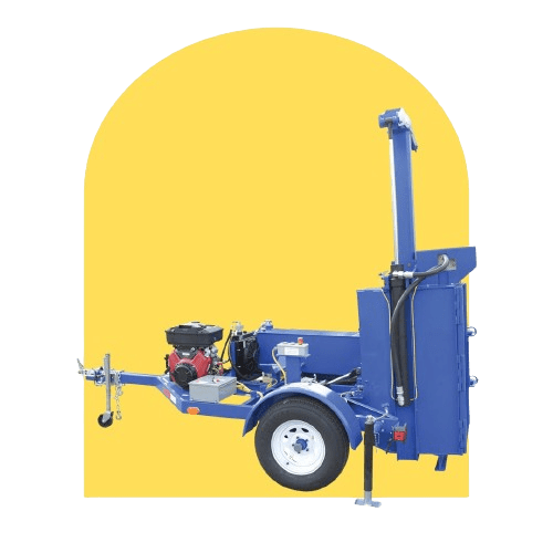 A blue industrial towable wood chipper, perfect for waste volume reduction, stands against a yellow background. It features a metal frame with a red motor, trailer hitch in front, and sturdy wheels. The chute is angled upward to efficiently direct chipped wood.