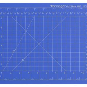 The Dahle Vantage® Premium Self-Healing Cutting Mat, 9 x 12, in blue, features white grid lines with inch measurements and diagonal guides at 60 and 45 degrees. Labeled Vantage Cutting Mat 12 x 9 on the top right, its ideal for detailed work. Available in a case of 48.